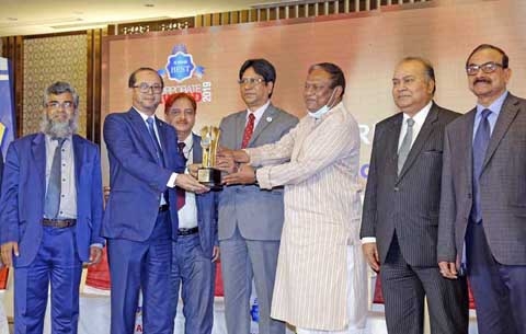 Mohammed Monirul Moula, Managing Director and CEO of Islami Bank Bangladesh Limited, receiving the ICMAB Best Corporate Award 2019 in Islamic Operation category among Private Commercial Bank from Commerce Minister Tipu Munshi, MP, at a hotel in the city r