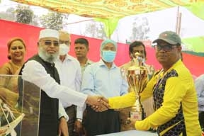 Chief guest Member of the Standing Committee on the Ministry of Jute and Textiles Mohammad Habib Hasan, MP, handing over the champions trophy to Md Masud Alam, the Captain and Director of Administration of Milestone College, at the Permanent Campus