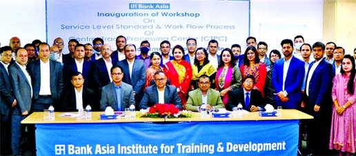 Mohammad Borhanuddin, DMD & COO of Bank Asia Limited, poses for a photo with the participants of a day-long training on "Service-Level Standard & Work Process Flow of CTPC (Central Trade Processing Centre)" for 48 officers of the bank held at the bank'