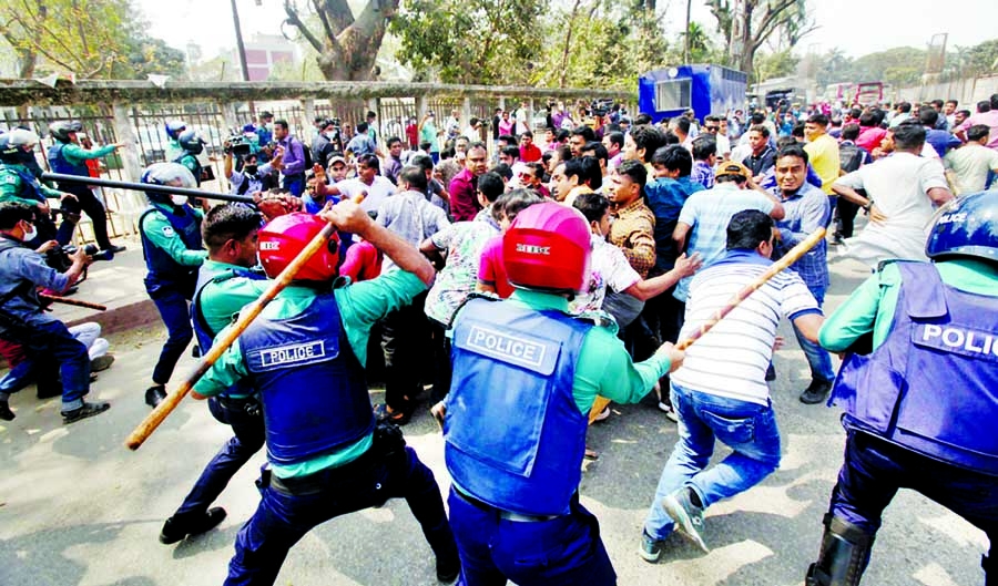 Police beat up Chhatra Dal activists in front of the National Press Club area in the capital on Sunday.