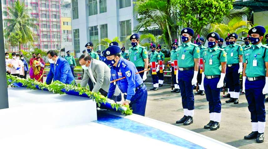 Home Minister Asaduzzaman Khan and IGP Dr. Benazir Ahmed pay floral tributes at the memorial plaque in memory of police who were killed at Mirpur Police Staff College in the city on Monday marking Police Memorial Day-2021.