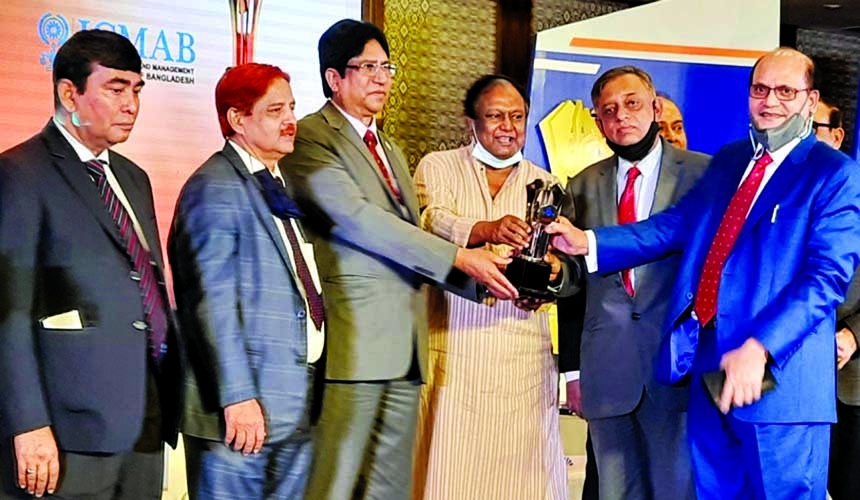 Abdus Samad, former Sr. Secretary and Chairperson of Social Development Foundation (SDF), receiving the ICMAB Best Corporate Award from Commerce Minister Tipu Munshi at a function held at a city hotel recently. AZM Sakhawat Hossain, Managing Director and