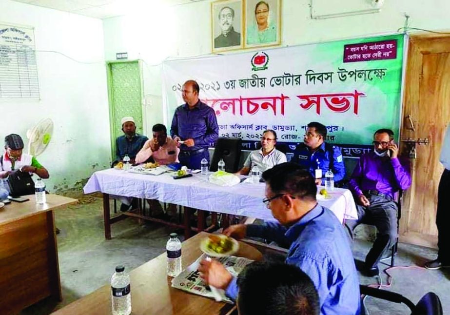 Alamgir Hossain Majhi, Chairman of Damudya Upazila Parishad in Shariatpur district, attends a discussion meeting as chief guest on Tuesday marking the National Voters' Day 2021