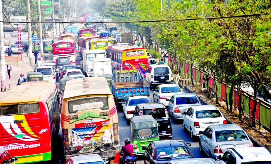 Vehicles get stuck in a traffic jam on Tejgaon road in the capital on Tuesday causing huge sufferings to the commuters and motorists.