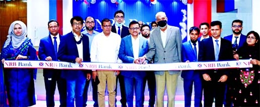 Mamoon Mahmood Shah, Managing Director & CEO of NRB Bank Limited, inaugurating the bank's 47th branch at Pragati Sarani in the city recently. Oli Ahad Chowdhury, Head of Retail Banking and other senior officials of the bank were present.