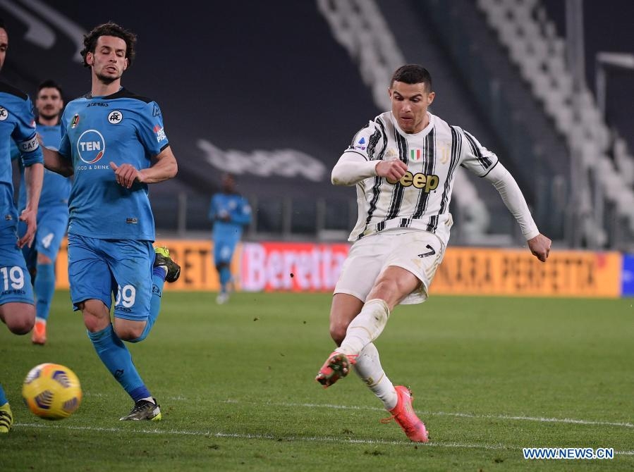FC Juventus' Cristiano Ronaldo (right) scores his goal during a serie A football match between FC Juventus and Spezia in Turin, Italy on Tuesday.