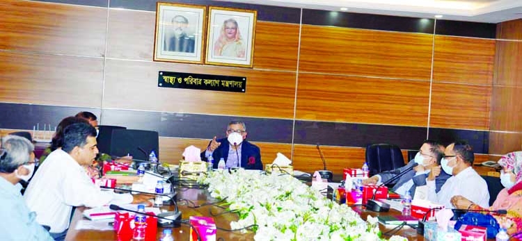 Health and Family Welfare Minister Zahid Maleque presides over the meeting on 'Covid-19 Vaccine Deployment and Management' at the conference room of the ministry on Wednesday.