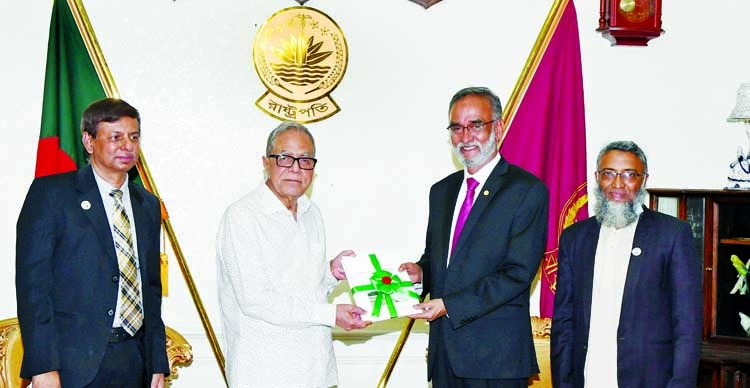 A delegation led by Comptroller and Auditor General (CAG) of Bangladesh Mohammad Muslim Chowdhury submits its Annual Audit Report-2017-2018 to President Abdul Hamid at Bangabhaban on Tuesday. PID photo