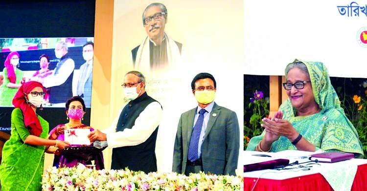 On behalf of Prime Minister Sheikh Hasina, Science and Technology Affairs Minister Architect Yafesh Osman distributes Bangabandhu Science and Technology Fellowship, NST Fellowship and research grant aid among the researchers and students of different uni
