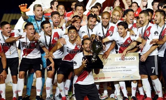 River Plate's players celebrate the Argentina Super Cup victory after beating Racing Club in the final at Mendoza in Argentina on Thursday.