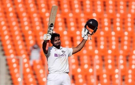 Rishabh Pant of India celebrates his century on the 2nd day of the fourth Test between India and England, at Ahmedabad in India on Friday.