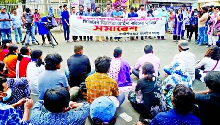 Workers and students gathered in front of the National Museum in the capital on Friday afternoon demanding trial over the "murder"" of writer Mushtaq Ahmed and repeal of the Digital Security Act."