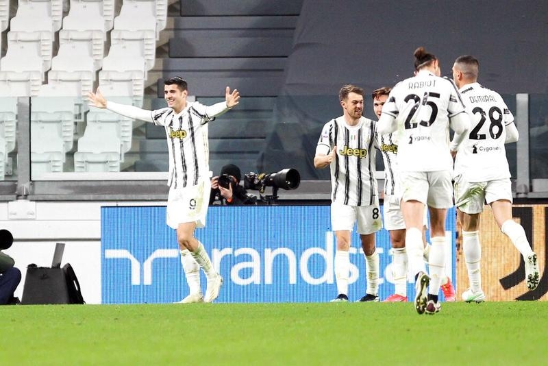 Juventus' Alvaro Morata (left) celebrates after scoring his side's second goal against Lazio during the Serie A soccer match in Turin's Allianz Stadium, Italy on Saturday.