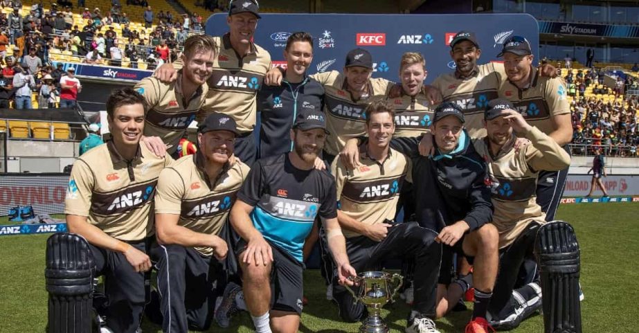 New Zealand cricket team celebrates with Trans-Tasman trophy after beating Australia on Sunday.