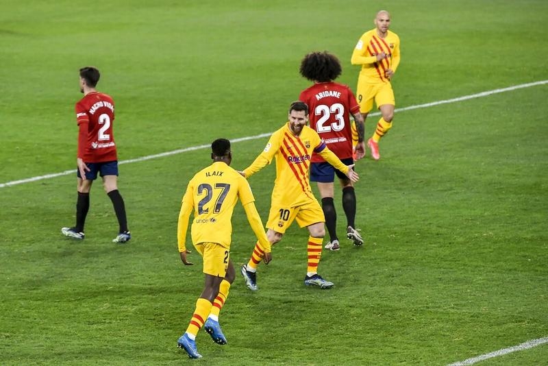 Barcelona's Ilaix Moriba (second left) celebrates with teammate Messi (center) after scoring his side's second goal against Osasuna during the Spanish La Liga soccer match at El Sadar stadium in Pamplona, Spain on Saturday.