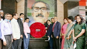 A team led by Md Obaid Ullah Al Masood, Managing Director and CEO of Rupali Bank Limited, paying homage to the portrait of Bangabandhu Sheikh Mujibur Rahman on the occasion of historic 7 March at the bank's head office premises on Sunday.