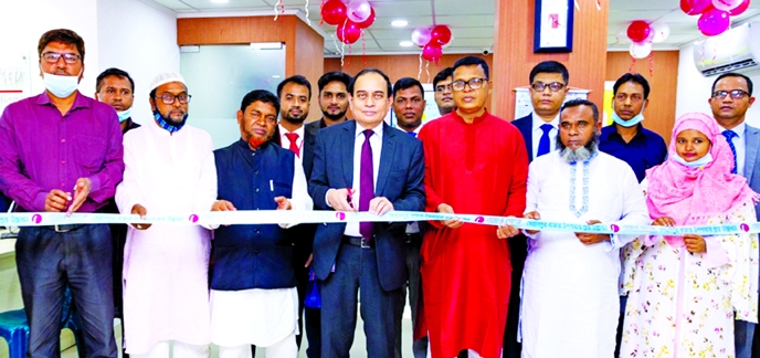 M. Fakhrul Alam, Managing Director of ONE Bank Limited, inaugurating the bank's sub-branch at Shohagpur Bazar in Mirzapur in Tangail on Monday. Kamal Hossain, DGM of Tangail Palli Bidyut Samity, high officials of the bank and local elites were present.