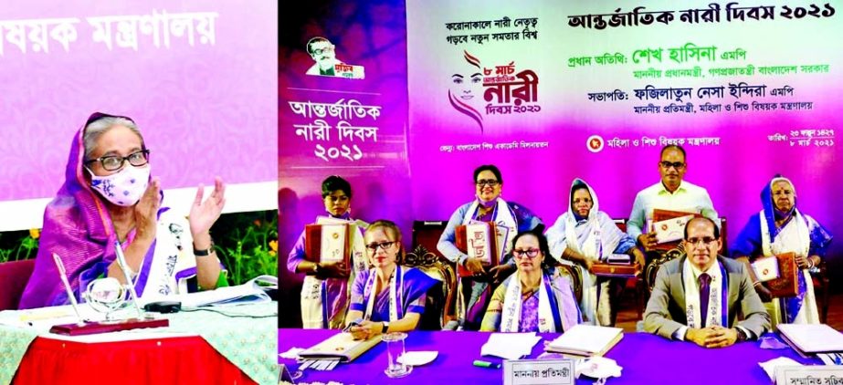 State Minister for Women and Children Affairs Fazilatun Nesa Indira poses for a photo session with the recipients of 'Joyeeta Padak-2021' in the auditorium of Bangladesh Shishu Academy in the city on Monday marking the International Women's Day. Prime