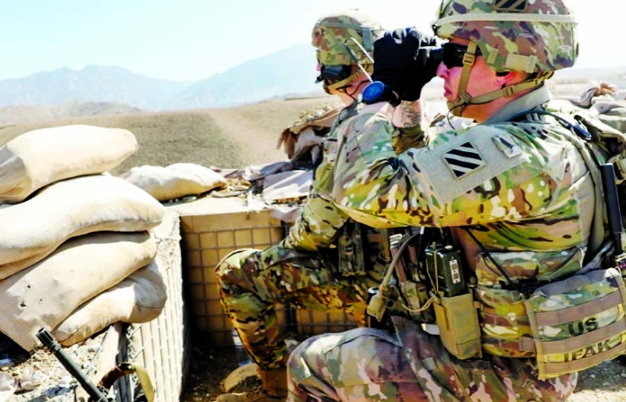 A handout photo made available by the US Army shows soldiers from the 1-108th Cavalry Regiment of the 48th Infantry Brigade Combat Team scanning key terrain and provide security during a key leader engagement in Kapisa Province, Afghanistan, 16 February 2