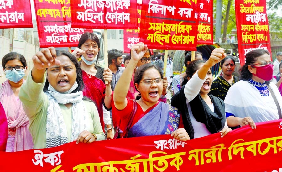 Activists of Samajtantrik Nari Forum chant slogans during a procession in front of National Press Club in the capital on Monday demanding an end to the repression against women on the occasion of International Women's Day.