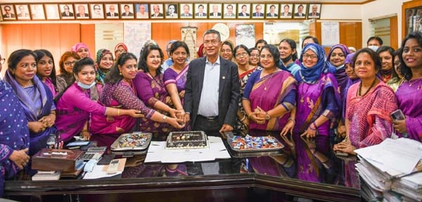 Md. Abdus Salam Azad, Managing Director & CEO of Janata Bank Limited along with women entrepreneurs and senior officials of the bank cutting a cake marking the International Women's Day at the bank's head office in the city on Monday.