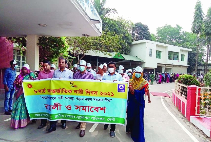 A cross section of people bring out a rally organized by Feni district LGED in the town on Monday marking the International Women's Day. Md. Ashraf Jamil, Senior Assistant Engineer, LGED, Deputy Assistant Engineers and various levels of officers and empl