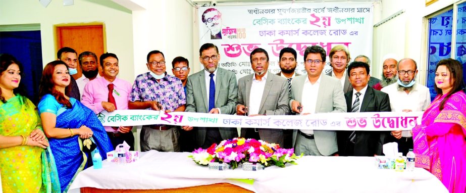 Md. Rafiqul Islam along with Md. Razib Parvez, Directors of BASIC Bank Limited, inaugurating the bank's 2nd sub-branch at Dhaka Commerce College Road in city's Mirpur area on Wednesday. Ahmed Hossain, Managing Director of the bank and local elites were