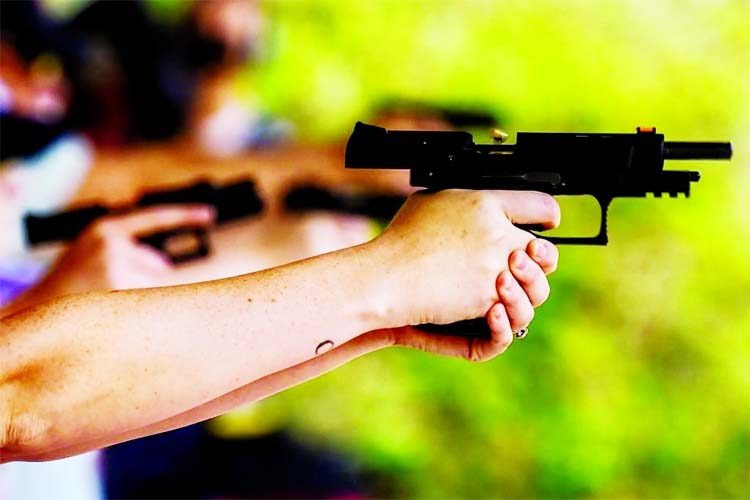 A student fires a handgun during a shooting course at Boondocks Firearms Academy, in Jackson, Mississippi.