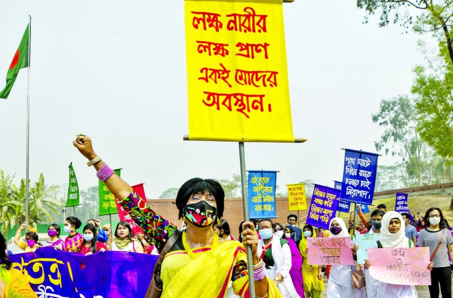 Women under the banner of International Women's Day Committee bring out a procession for democracy in the capital on Friday.