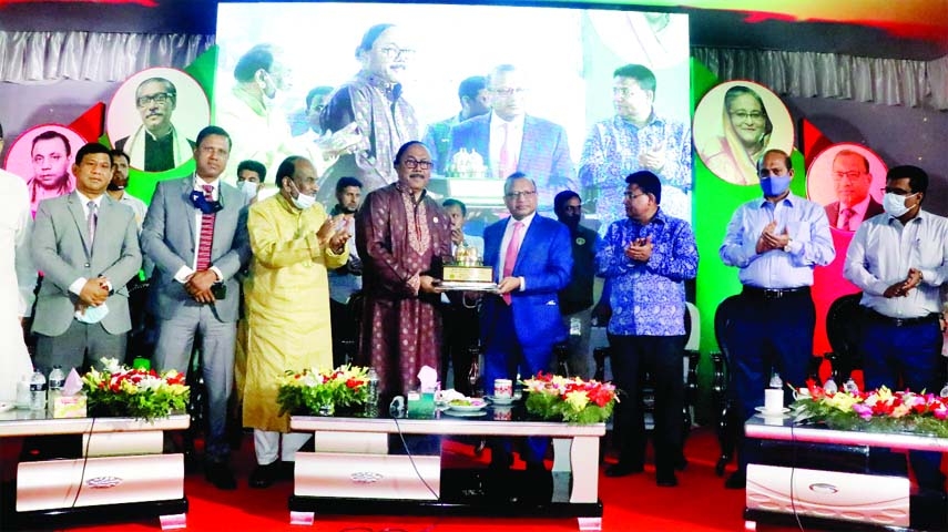 Local Government, Rural Development and Cooperatives Minister Tazul Islam, MP is seen receiving a memento at a civic meeting at RCC Green Plaza on Saturday.
