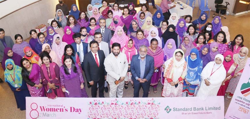 Khandaker Rashed Maqsood, Managing Director & CEO along with other senior officials of Standard Bank Limited, poses for photo session on the occasion of celebrating International Women's Day-2021 at the bank's head office recently. Marking the day, all