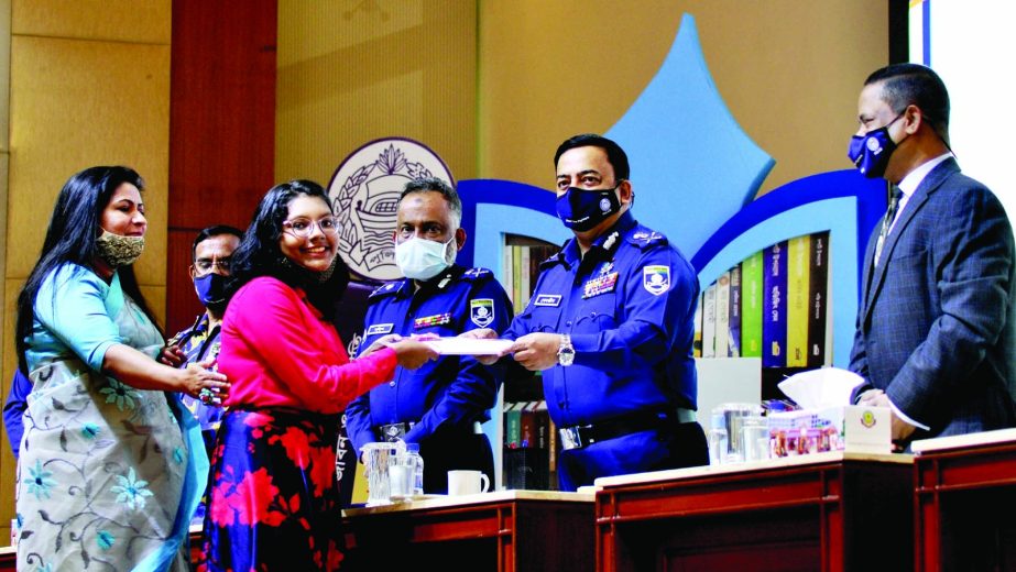 IGP Benazir Ahmed hands over education stipend among the students at the stipend distribution ceremony organised by Bangladesh Police Service Foundation at Rajarbagh Bangladesh Police Lines auditorium in the city on Monday.