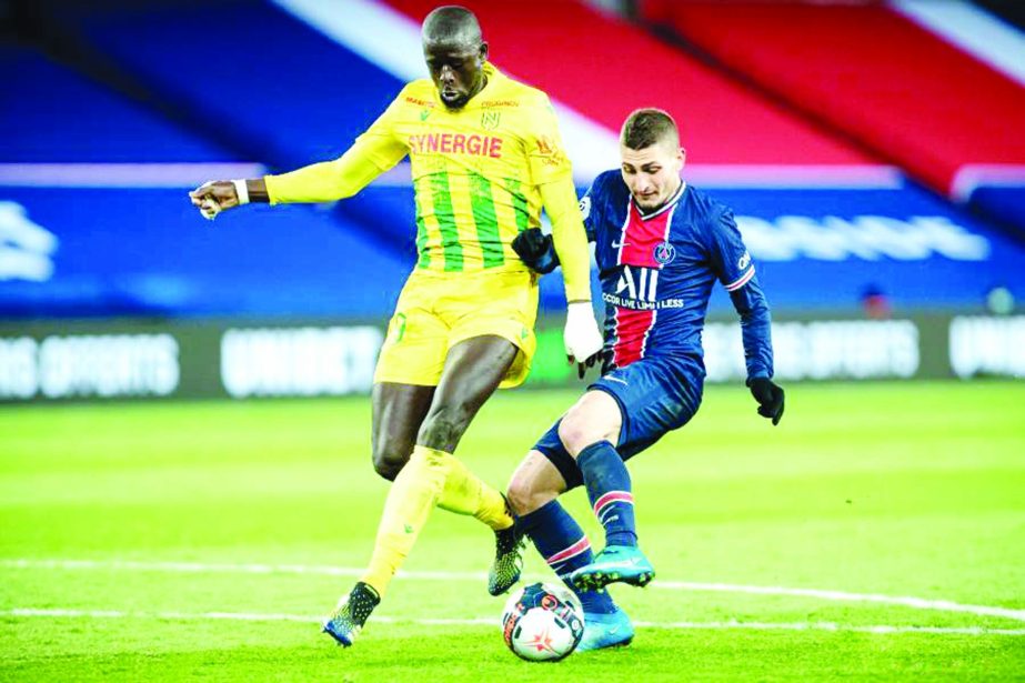 Marco Verratti (right) of PSG vies with Abdoulaye Toure of Nantes during the French Ligue 1 football match at Parc des Princes stadium in Paris, France on Sunday.