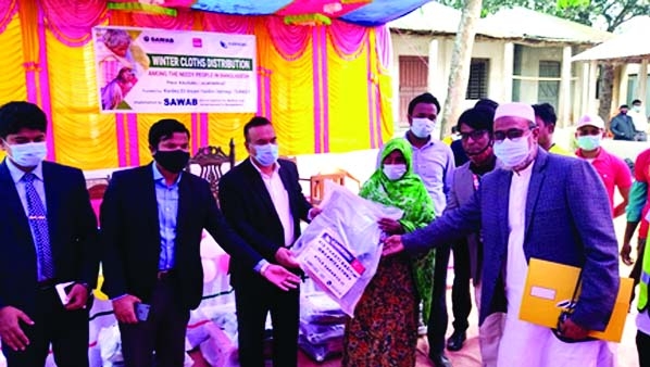 Lalmonihat Deputy Commissioner, Md. Abu Zafar is, among others, seen distributing clothes among the poor families at Chamta Hat High School ground in Kaliganj upazila of Lalmonirhat district on Sunday. Also present at the programme were Executive Magistra