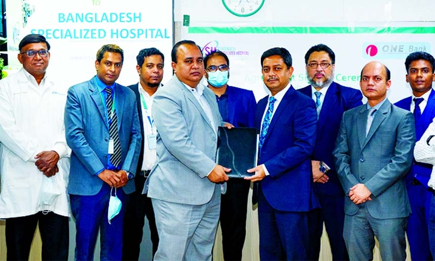 Al Emran Chowdhury, Director & CEO of Bangladesh Specialized Hospital Limited and Md. Kamruzzaman, Head of Retail Banking of ONE Bank Limited, exchanging document after signing an agreement at the bank's head office recently. Under the deal, Debit, Credi