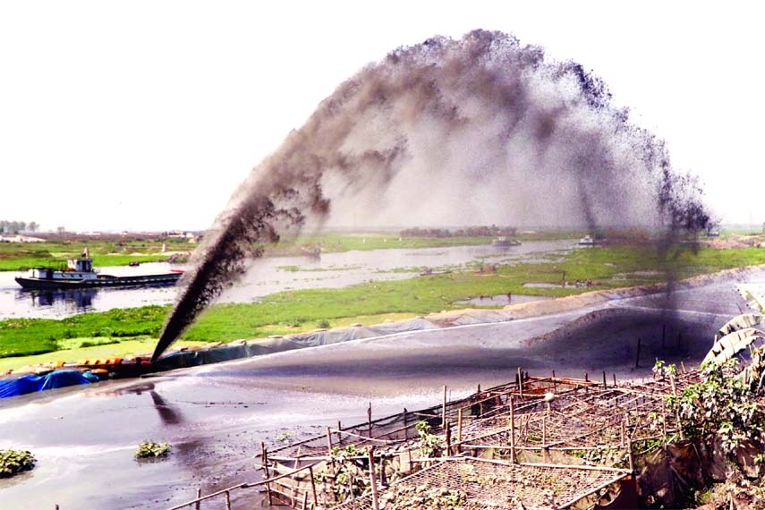 Dredging work goes on for earth filling across the country caring little about the environment. This photo was taken from Turag River at Mirpur area in the capital.