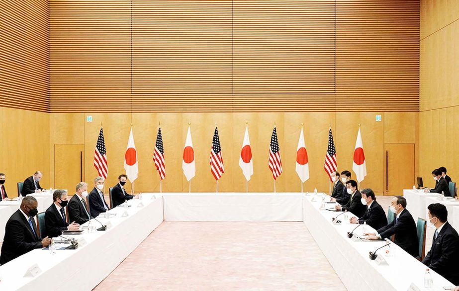 US Secretary of State Antony Blinken (2nd L) and Defense Secretary Lloyd Austin (L) meet with Japan's Prime Minister Yoshihide Suga (2nd R) during a courtesy call at the prime minister's office in Tokyo.
