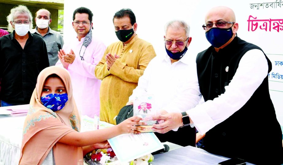 State Minister for Information and Broadcasting Dr. Murad Hasan hands over prizes among the winners of drawing competition held on the occasion of birth centenary of Father of the Nation Bangabandhu Sheikh Mujibur Rahman.at Amphitheater in the city's Hat