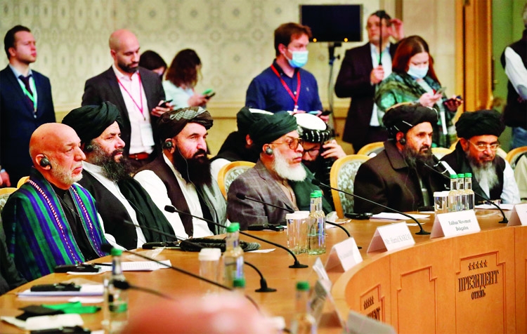 Officials, including Afghan former President Hamid Karzai and the Taliban's deputy leader and negotiator Mullah Abdul Ghani Baradar, attend the Afghan peace conference in Moscow, Russia.