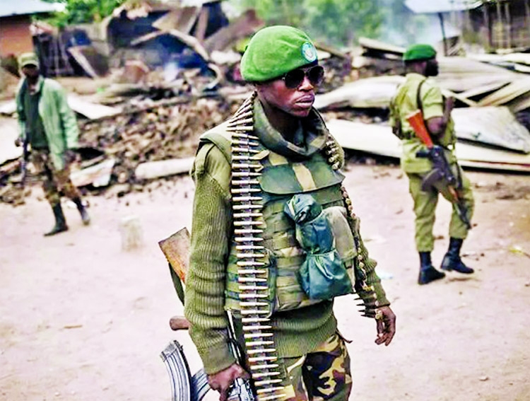 DR Congo troops on patrol in Manzalaho, a village near Beni, after an attack blamed on the ADF.