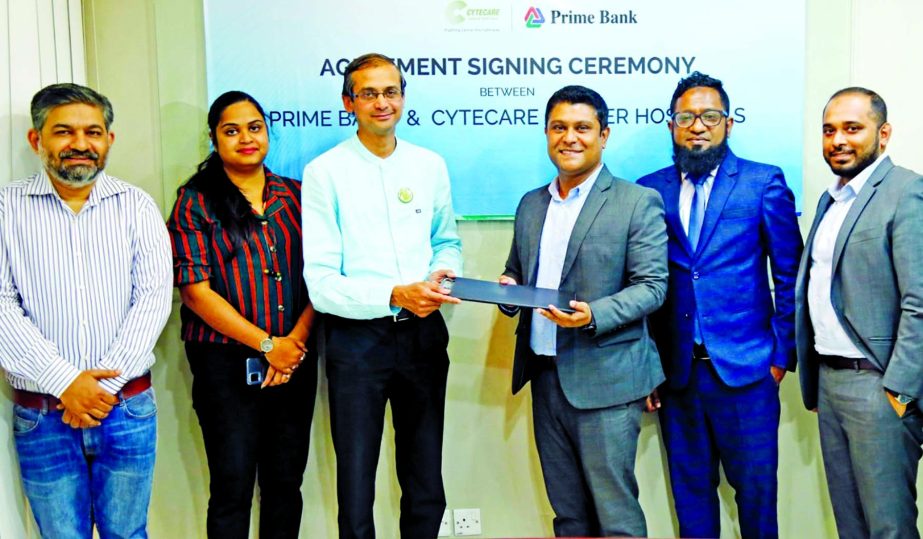 Masudul Haque Bhuiyan, Head of Cards and ADC of Prime Bank Limited and Suresh Ramu, Co-founder and CEO of Cytecare Cancer Hospital (Bengaluru, India), exchanging document after signing a MoU at the bank's head office in the capital recently. Under the de