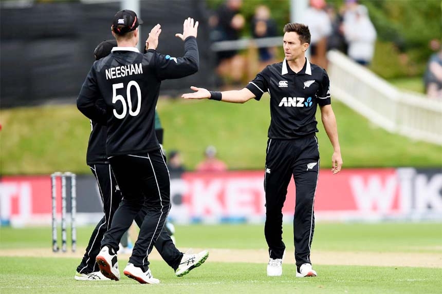 Trent Boult (right) of New Zealand, celebrates with his teammates after dismissal of Tamim Iqbal (not in the picture) during the first ODI match between Bangladesh and New Zealand at University Oval in Dunedin, New Zealand on Saturday. Boult captured four