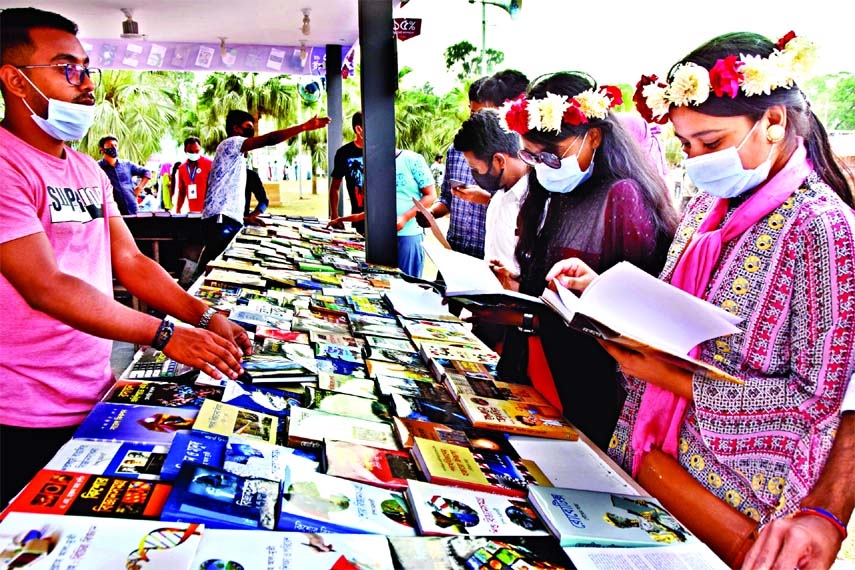 Book lovers visit a stall on the 3rd day of Ekushey Book Fair at Suhrawardy Udyan in the capital on Saturday.