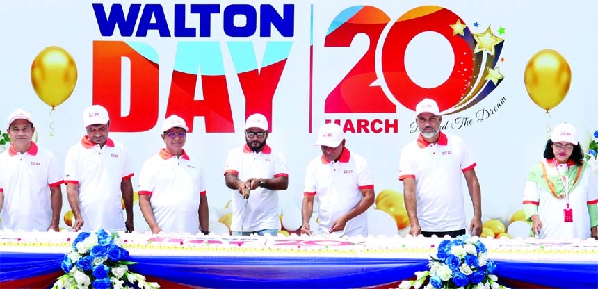 Engineer Golam Murshed, Managing Director of Walton Hi-Tech Industries Limited (WHIL), inaugurating the 'Walton Day' through cutting a cake at company's head office in the capital on Saturday. Abul Bashar Howlader, AMD, Nazrul Islam Sarker, Eva Rezwana
