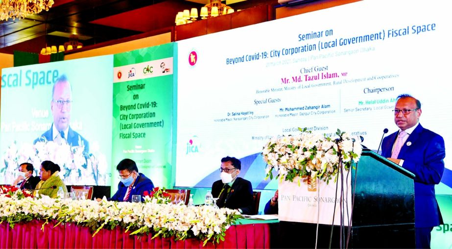 Local Government Minister Md. Tajul Islam speaks at a seminar titled 'Beyond Covid-19: City Corporation (Local Government) Fiscal Space' at a hotel in the capital on Sunday.