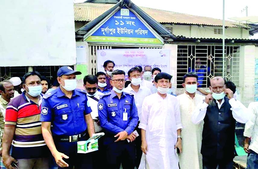 As part of the Bangladesh Police's awareness program on health protection from coronavirus, masks and sanitizers were distributed and awareness meetings were held at various places in the upazila on Sunday morning, March 21 at the initiative of Kapasia T