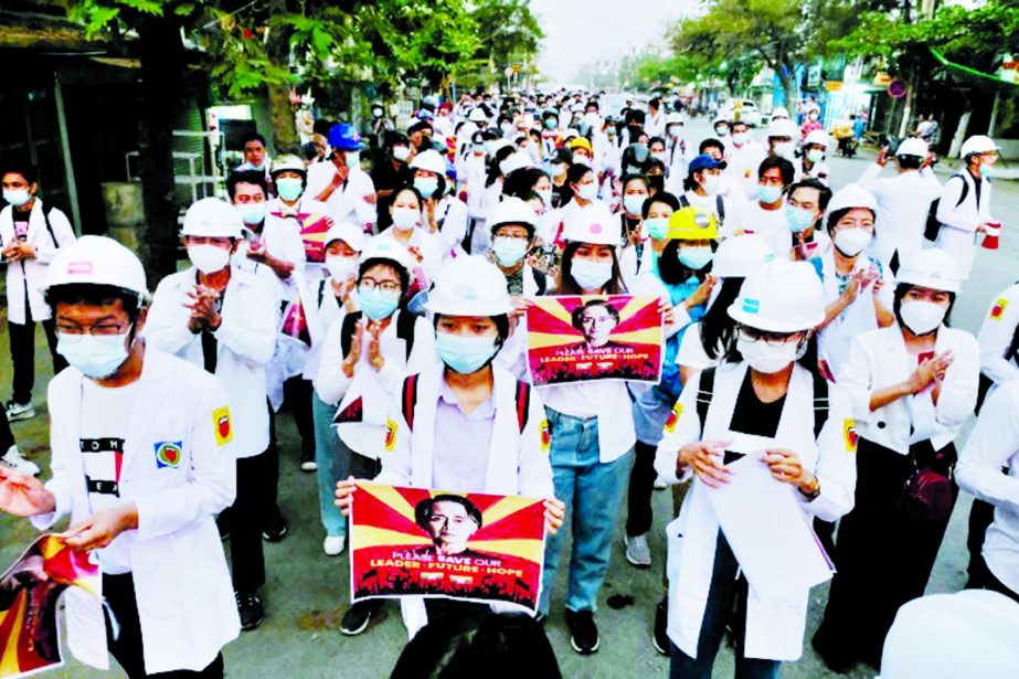 Medical staff and students took part in Sunday early morning protest against the military coup in Mandalay, Myanmar.