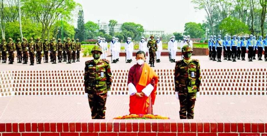 Bhutanese Prime Minister Dr Lotay Tshering pays tributes to the Liberation War martyrs by placing a wreath at the National Martyrs' Memorial in Savar on Tuesday.