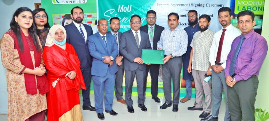 Md. Shaheen Howlader, Head of Corporate & Investment Banking Division of Modhumoti Bank Limited and Md. Asaduzzaman, CEO of Electro Globe, exchanging document after signing an agreement in the capital on Tuesday. Under the deal, employees of Electro Globe