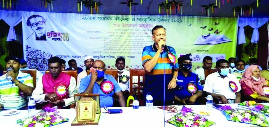 Md. Baki Billah, Chairman of Bhangura Upazila inaugurates the 7-day long Book Fair and Cultural Festival organized by Sachetan Literary Cultural Committee at Government Bhangura Union School and College ground under Pabna district on Sunday